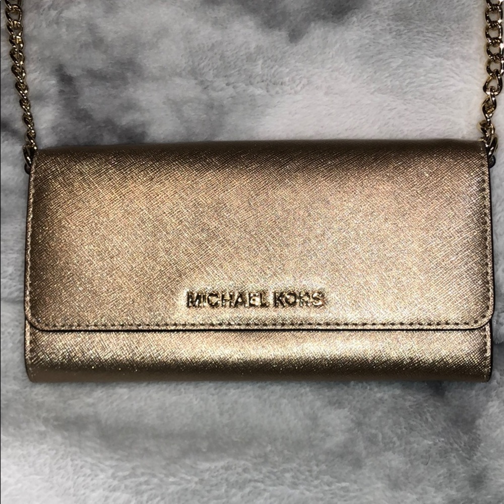 Gold Michael Kors purse.